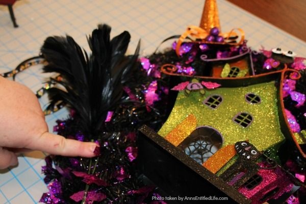 Haunted House Halloween Wreath. This whimsical haunted house Halloween wreath is an easy to put together - truly a 15-minute craft!  If you are looking for simple Halloween wreath ideas, look no further than this fun haunted house Halloween wreath DIY.