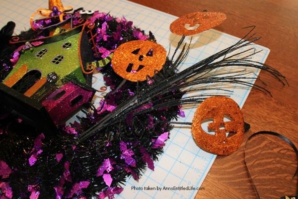 Haunted House Halloween Wreath. This whimsical haunted house Halloween wreath is an easy to put together - truly a 15-minute craft!  If you are looking for simple Halloween wreath ideas, look no further than this fun haunted house Halloween wreath DIY.