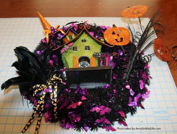 Haunted House Halloween Wreath. This whimsical haunted house Halloween wreath is an easy to put together - truly a 15-minute craft!  If you are looking for simple Halloween wreath ideas, look no further than this fun haunted house Halloween wreath DIY.