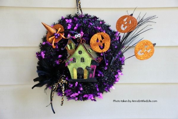 Haunted House Halloween Wreath. This whimsical haunted house Halloween wreath is an easy to put together - truly a 15-minute craft!  If you are looking for simple Halloween wreath ideas, look no further than this fun haunted house Halloween wreath DIY.