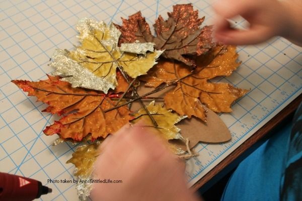 Dollar Store Craft: Easy Thanksgiving Door Hanger DIY. An inexpensive, festive, Thanksgiving door craft perfect for side doors, classroom doors, or anywhere where a flat door hanger is needed.