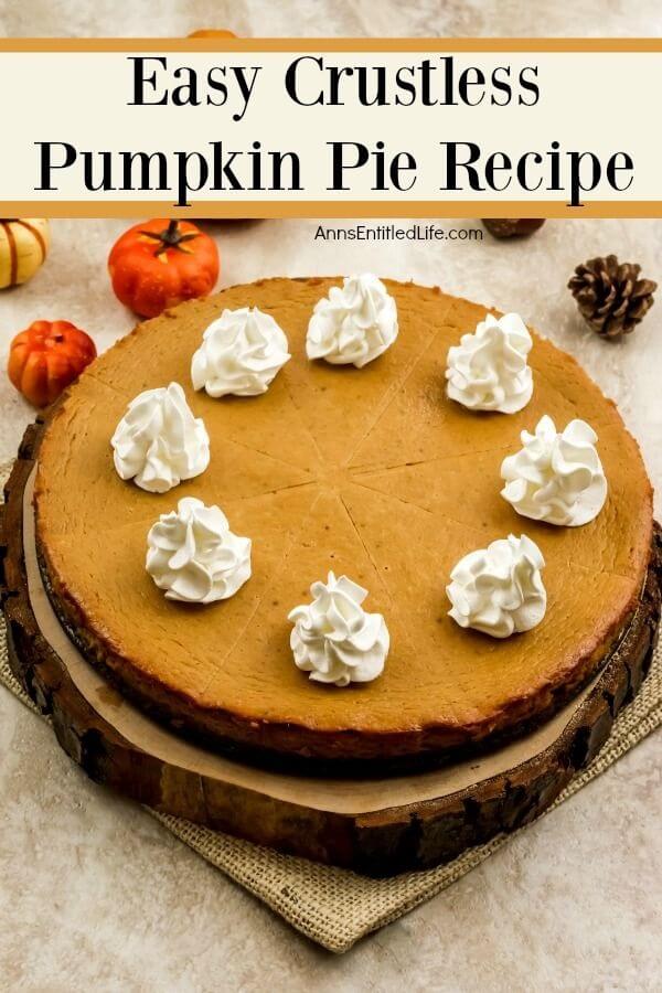 A whole crustless pumpkin pie set atop a wooden tray. There is fall decor surrounding the pumpkin pie.