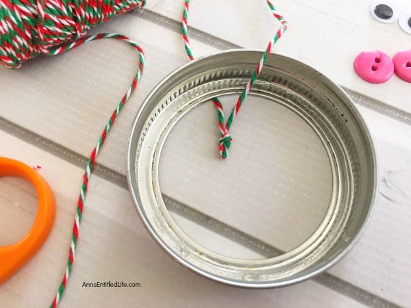 Gingerbread Man Mason Jar Lid Ornament DIY. Give your Christmas tree a personal touch and make your own ornaments this holiday season. Follow these step-by-step tutorial instructions to make this adorable Gingerbread Man Mason Jar Lid Ornament!