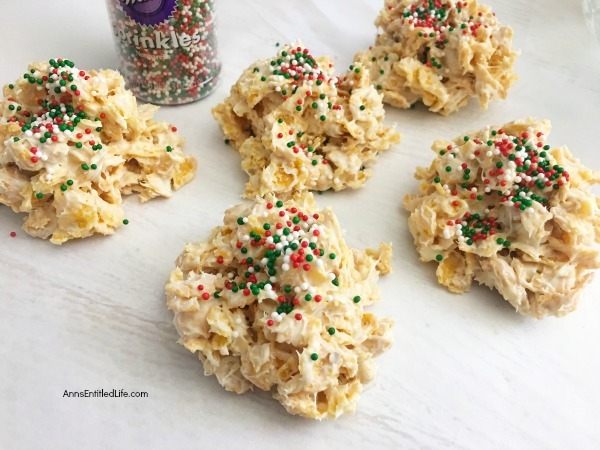Easy Cornflakes Christmas Clusters Recipe. It is the holiday season and sometimes things are so hectic it is difficult to make time to bake or cook holiday centric-dishes. But everyone has time to make these super easy cornflake Christmas clusters. This simple 4-ingredient recipe is festive, tasty, and you can make them in about 5 minutes. These are a great tasting holiday treat your whole family will enjoy.