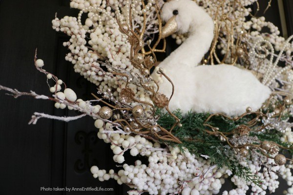 Golden Swan Wreath DIY. This stunning wreath takes only 15 minutes to make! Perfect for so many holidays, party functions (think bridal or shower), or as a year round wreath with a bit of bling, this unusual swan wreath is lovely wall décor or door décor!