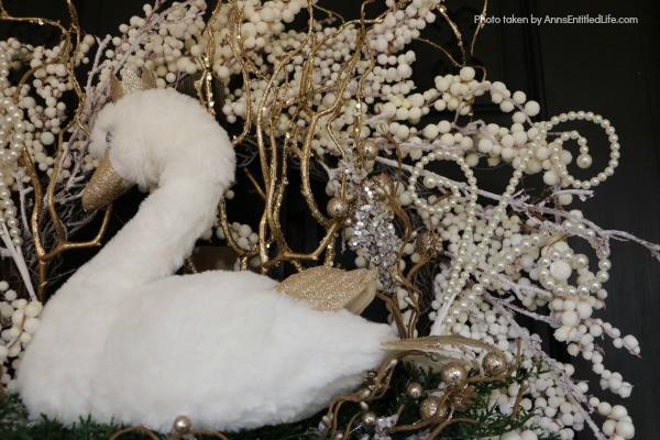 Golden Swan Wreath DIY. This stunning wreath takes only 15 minutes to make! Perfect for so many holidays, party functions (think bridal or shower), or as a year round wreath with a bit of bling, this unusual swan wreath is lovely wall décor or door décor!