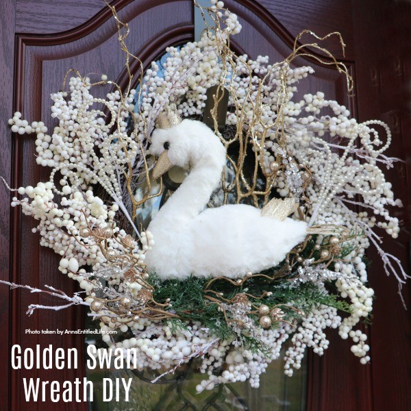 Golden Swan Wreath DIY. This stunning wreath takes only 15 minutes to make! Perfect for so many holidays, party functions (think bridal or shower), or as a year round wreath with a bit of bling, this unusual swan wreath is lovely wall décor or door décor!