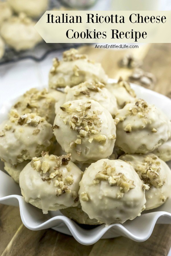 A close-up of a white plate filled with Italian Ricotta cheese cookies.