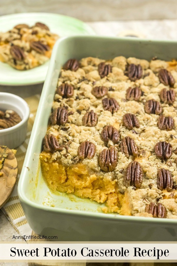 a green baking pan filled with sweet potato casseole, one serving is removed to a plate on the left