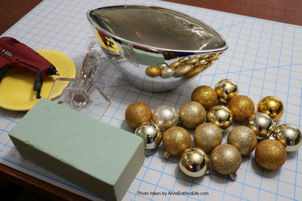 Bubbly New Year's Eve Table Décor. This upcycled New Year's Eve décor is a great celebration centerpiece! You can use this champagne bubbly inspired craft for your champagne party, as an accent at a party bar or as fun décor at any cocktail party - or simply leave it up year-round on your wet bar. Super easy to make, this Bubbly New Year's Eve Table Décor piece can be made in gold, silver, copper, rose gold, or pink champagne colors for a great added sparkle decoration adorning your party tabletop arrangement.