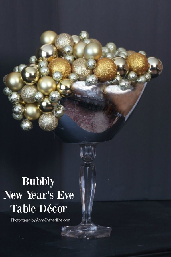 Bubbly New Year's Eve Table Décor. This upcycled New Year's Eve décor is a great celebration centerpiece! You can use this champagne bubbly inspired craft for your champagne party, as an accent at a party bar or as fun décor at any cocktail party - or simply leave it up year-round on your wet bar. Super easy to make, this Bubbly New Year's Eve Table Décor piece can be made in gold, silver, copper, rose gold, or pink champagne colors for a great added sparkle decoration adorning your party tabletop arrangement.