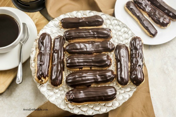 Homemade Chocolate Eclair Recipe. There is no more sophisticated pastry than an eclair! From filling a holiday dessert tray, to an elegant shower confection, or simply passed around at a party on a tray, this homemade chocolate eclair recipe will satisfy and impress with its creamy rich filling, and slightly sweet chocolate ganache topping. These homemade chocolate eclairs are an outstanding dessert perfect for any occasion.