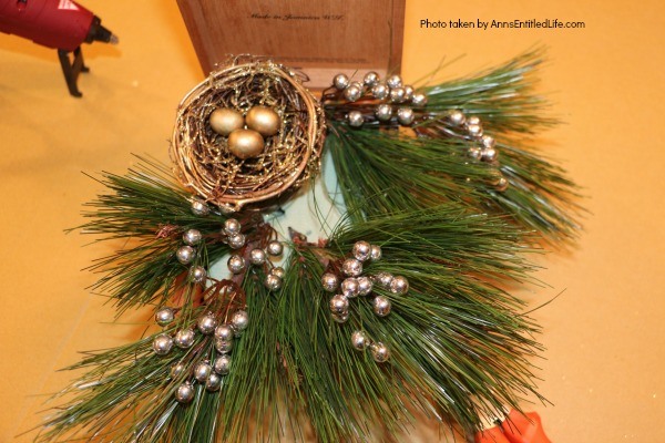 Wooden Box Bird's Nest Floral Arrangement. This adorable little birdie will look so sweet on a side table, fireplace mantel, or as part of a centerpiece! Use an old wooden box (this one is a cigar box), a bird and its nest, and in about 15 minutes you will have an unusual, but lovely, floral piece perfect in any décor!