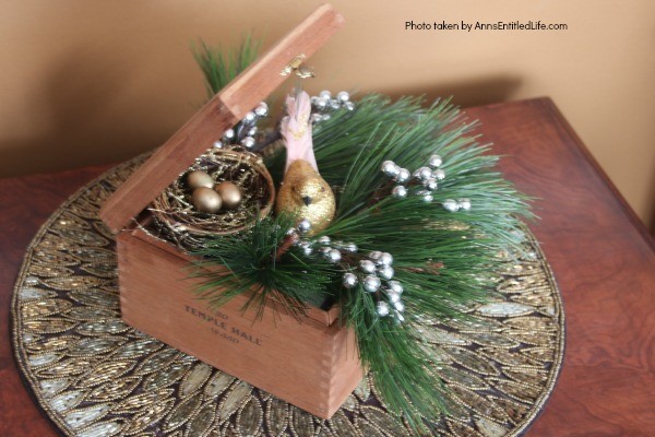 Wooden Box Bird's Nest Floral Arrangement. This adorable little birdie will look so sweet on a side table, fireplace mantel, or as part of a centerpiece! Use an old wooden box (this one is a cigar box), a bird and its nest, and in about 15 minutes you will have an unusual, but lovely, floral piece perfect in any décor!