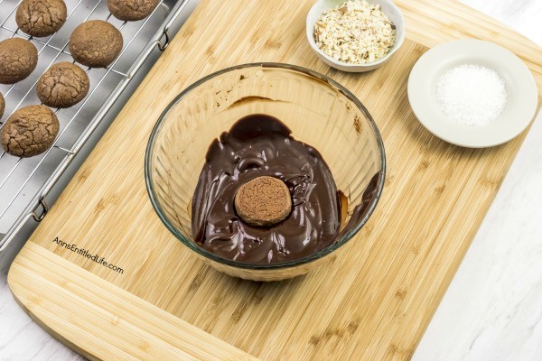 Cherry Cordial Cookies Recipe. A sinfully decadent chocolate cookie surrounds a cherry surprise in the middle! These easy to make cookies are fun and delicious. Your friends and family will love these tasty cookie treats!