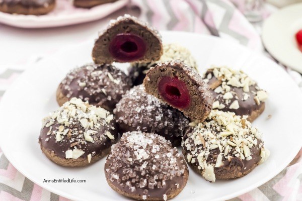 Cherry Cordial Cookies Recipe. A sinfully decadent chocolate cookie surrounds a cherry surprise in the middle! These easy to make cookies are fun and delicious. Your friends and family will love these tasty cookie treats!