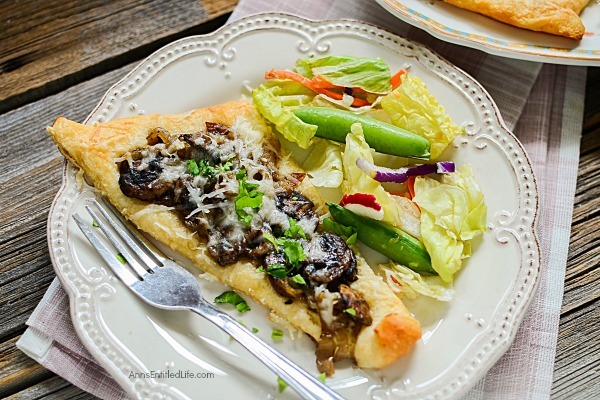 Mushroom Gruyère Triangle Tarts Recipe. A sophisticated, yet simple appetizer or lunch dish, these Mushroom Gruyère Triangle Tarts are super easy to make! Slightly salty, slightly sweet, this delicious little dish is perfect for parties, get togethers, or when you want something a little different for luncheon.