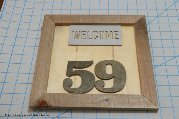 DIY Farmhouse House Numbers Sign. This cute little rustic plaque is fun to make. Large or small, this farmhouse house number sign can be sized to your house so it will fit perfectly in your chosen space. The easy to follow step-by-step tutorial will show you how to make this basic wooden sign look unique, fashionable, and charming.