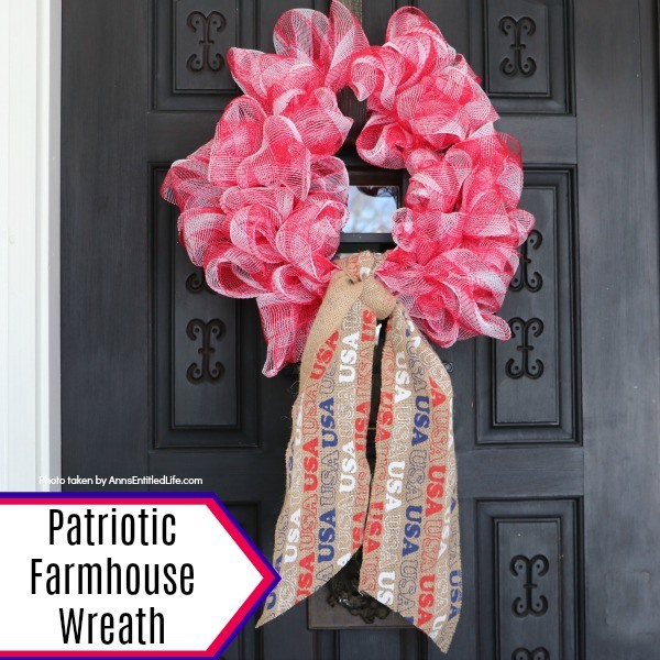 Patriotic Farmhouse Wreath DIY. This simple to make, rustic style American patriotic mesh farmhouse wreath is wonderful for outdoor or indoor display. Using only three materials and scissors, this easy to make wreath comes together in about 15 minutes. If you are looking for a patriotic holiday wreath, this little beauty is it!