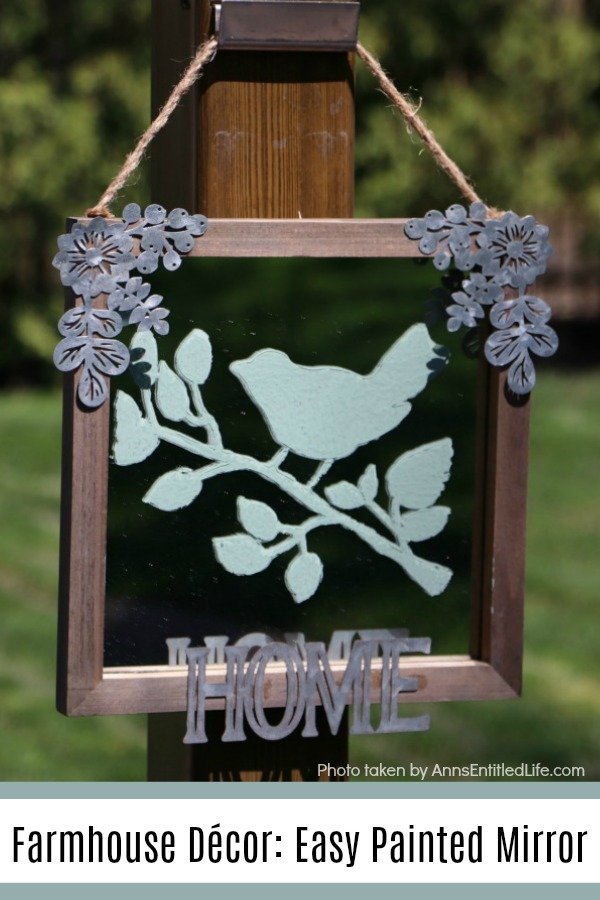 painted green bird stencil on a rustic frame mirror