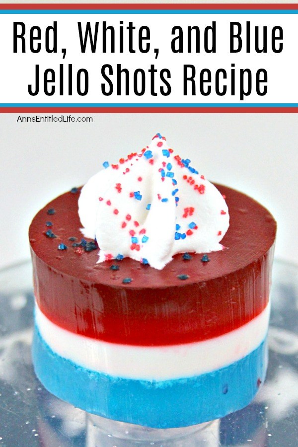 red, white and blue jello shots with a dab of whipped cream on top