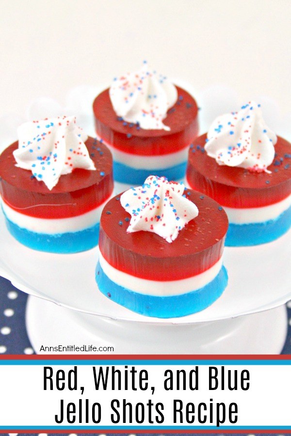 red, white and blue jello shots with a dab of whipped cream on top