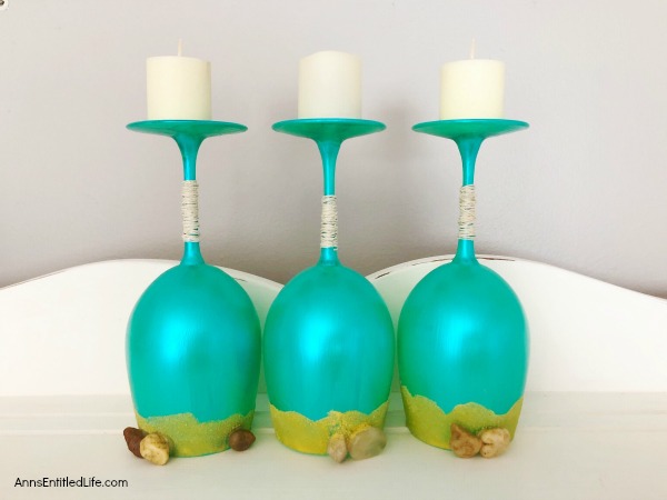 Beach Wineglass DIY Décor. Make your own beach themed wineglasses with these easy step-by-step tutorial instructions. This is a great summertime craft, makes a fabulous shark week decoration, or if you have beach themed décor in your home or on your lanai, patio or in your three-season room, this is a fun and funky craft project to add to it. These highly customizable beach wineglasses are simple to make and will look great on your mantel, side table or as part of a larger décor theme.