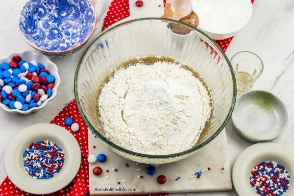 Fireworks Blondies Recipe. These fun, easy to make Fireworks Blondies are the perfect treat for your patriotic celebration. These delicious little bars transport well. Add M&Ms, sprinkles, red, white, blue jimmies or stars to customize your Independence Day dessert.