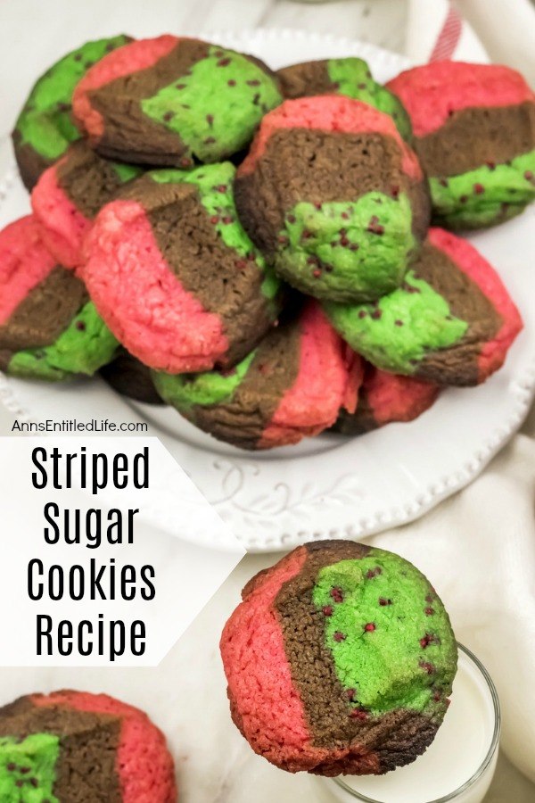 red, green, chocolate striped cookies on a white plate, lower right stack of same zebra cookies on a milk glass, all on a white napkin background