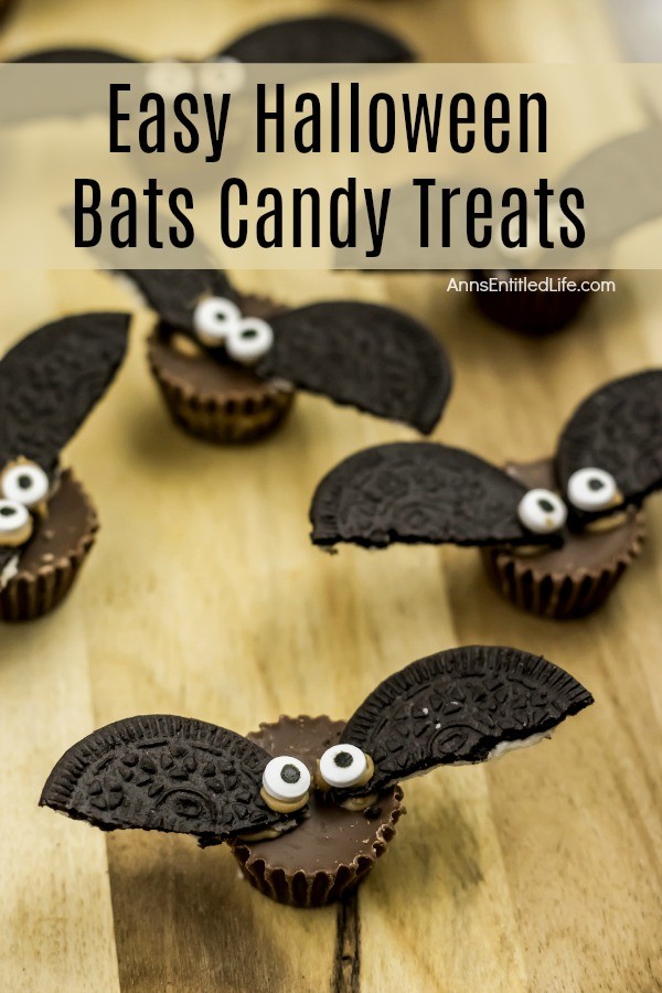 6 candy treats made up to look like bats, on a butcher block cutting board