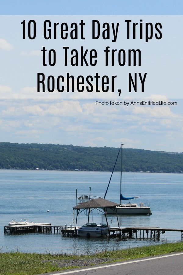 Docked boat and landing on Seneca Lake, another boat is anchored in the lake