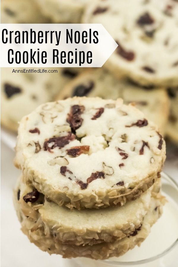 a stack of three cranberry noel cookies on white plate