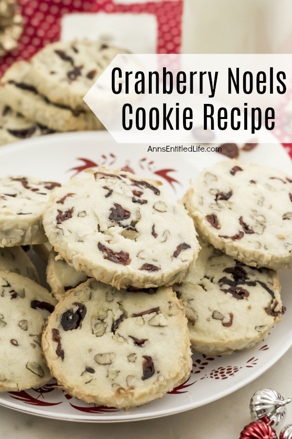 a white plate of cranberry noel cookies on a red and white polka dot background