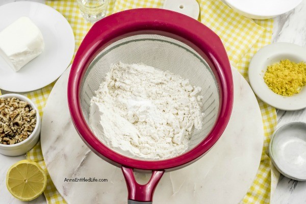 Lemon Snowball Cookie Recipe. The fresh, sweet-tart flavor make these Lemon Snowball Cookies are a change of pace Christmas Cookie. Easy to make, they are a welcome addition to your holiday cookie plate!