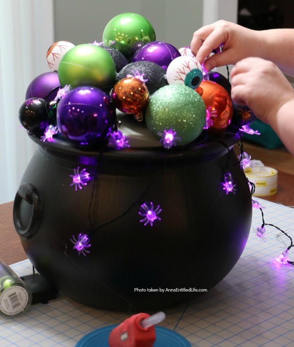 Homemade Halloween Witch's Cauldron. Make these adorable witches cauldrons for Halloween this year. This homemade cauldron packs a real visual punch. Beautiful to look at, creepy without being scary, this homemade Halloween witch's cauldron is great for Halloween décor, delight trick-or-treaters, or as a fabulous Halloween party prop.