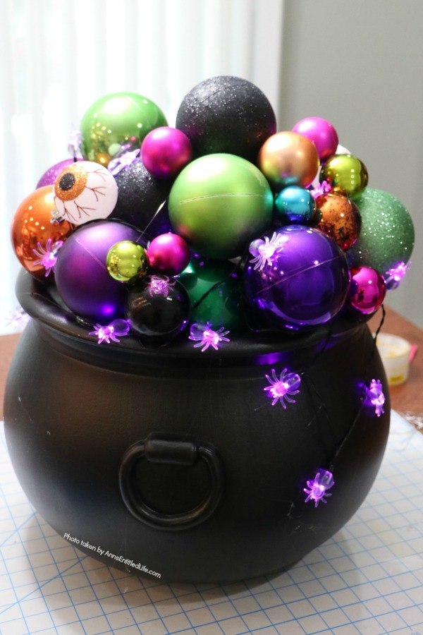 Homemade Halloween Witch's Cauldron. Make these adorable witches cauldrons for Halloween this year. This homemade cauldron packs a real visual punch. Beautiful to look at, creepy without being scary, this homemade Halloween witch's cauldron is great for Halloween décor, delight trick-or-treaters, or as a fabulous Halloween party prop.