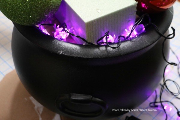 Homemade Halloween Witch's Cauldron. Make these adorable witches cauldrons for Halloween this year. This homemade cauldron packs a real visual punch. Beautiful to look at, creepy without being scary, this homemade Halloween witch's cauldron is great for Halloween décor, delight trick-or-treaters, or as a fabulous Halloween party prop.