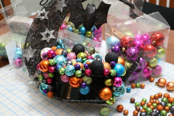 Homemade Halloween Witch's Cauldron Wreath. A step by step guide on making a halloween wreath inspired by a witch's cauldron! This easy to follow tutorial teaches you how to make a halloween witch's cauldron wreath. This wreath is perfect Halloween door decor your trick or treaters will love!