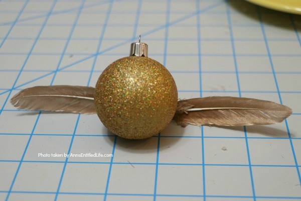 5 Minute Craft: Golden Snitch Ornament. Are you or your children Harry Potter fans? These easy to make golden snitch ornaments come together in under 5 minutes! Perfect for your tree, to give as a gift, or string for holiday decor.