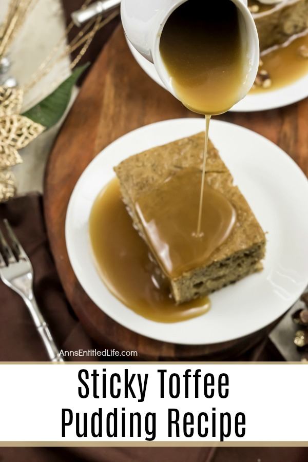 A serving of sticky toffee pudding on a white dish. There is a pitcher pouring the sauce over the cake. a second piece is in the upper left, a fork rests to the right.