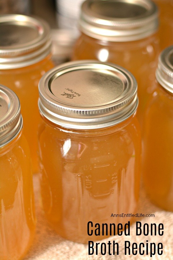 close-up of five jars of canned bone broth on a table