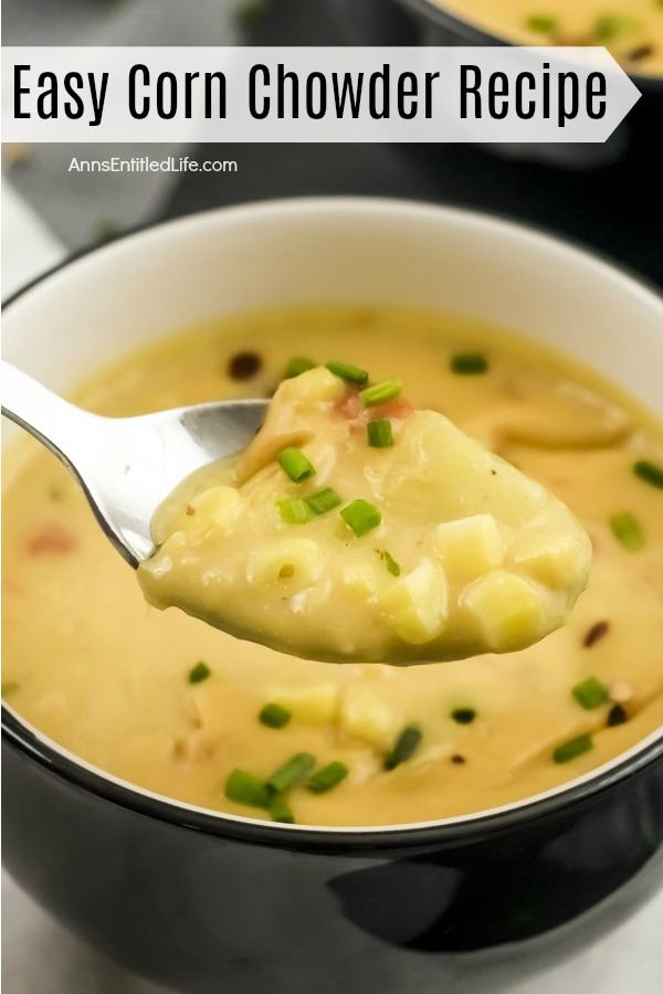 a silver spoonful of corn chowder lifted from a blue bowl