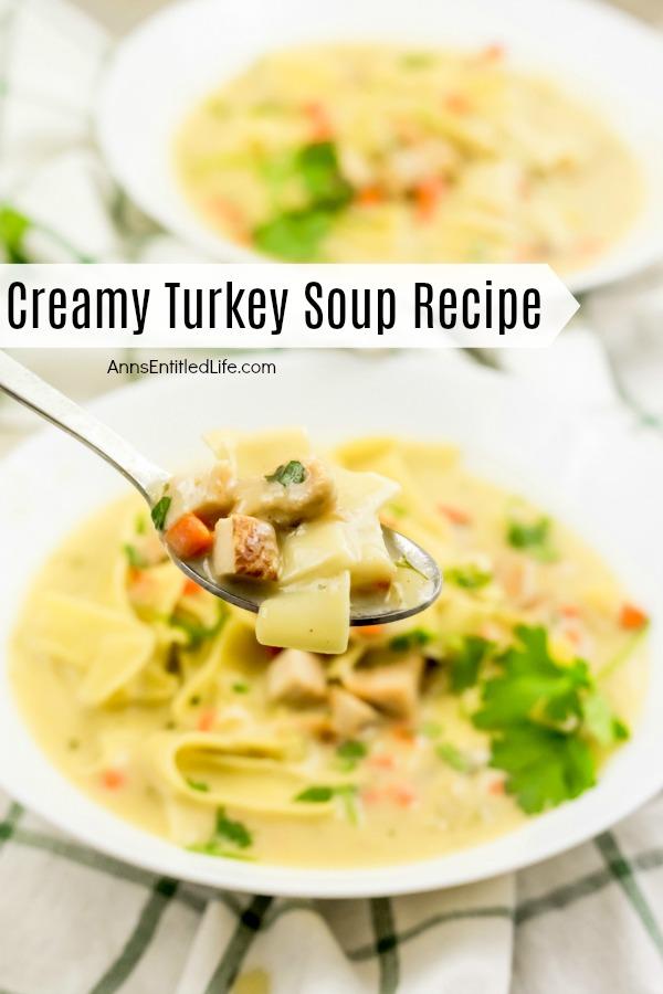 A spoonful of creamy turkey soup being lifted from a white bowl of turkey soup, on top of a green and white checked napkin, a second bowl in the upper right