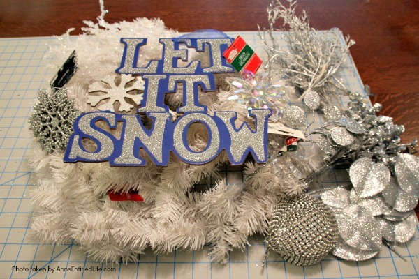 Let It Snow Wreath. This beautiful, blingy let it snow wreath is so easy to make! If you are looking for a fun and simply winter craft project to hang on your front door or over your fireplace mantel, you will want to make this sparkly winter wreath.