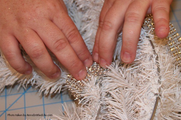 Let It Snow Wreath. This beautiful, bling-y let it snow wreath is so easy to make! If you are looking for a fun and simply winter craft project to hang on your front door or over your fireplace mantel, you will want to make this sparkly winter wreath.