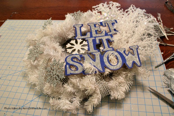 Let It Snow Wreath. This beautiful, blingy let it snow wreath is so easy to make! If you are looking for a fun and simple winter craft project to hang on your front door or over your fireplace mantel, you will want to make this sparkly winter wreath.