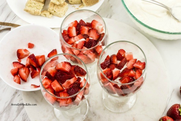 Strawberry Shortcake Cheesecake Parfait Recipe. This easy-to-make, from scratch, strawberry shortcake cheesecake parfait comes together in no time flat! Your friends and family will love this tasty delight. A fantastic dessert or snack any time of the year, this terrific strawberry parfait recipe is a party for your taste buds.