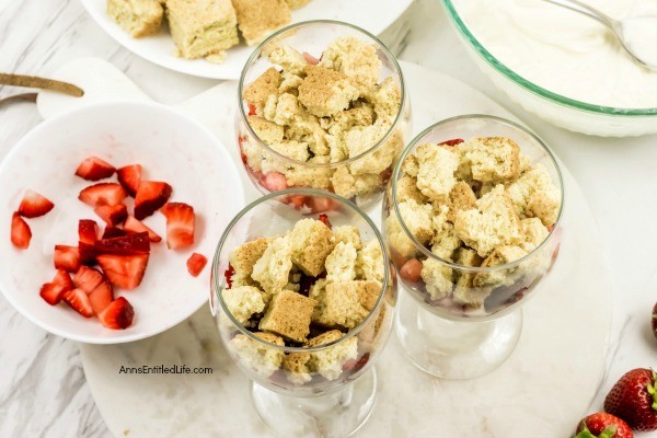 Strawberry Shortcake Cheesecake Parfait Recipe. This easy-to-make, from scratch, strawberry shortcake cheesecake parfait comes together in no time flat! Your friends and family will love this tasty delight. A fantastic dessert or snack any time of the year, this terrific strawberry parfait recipe is a party for your taste buds.