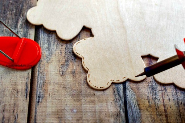 Wood Burned Snowflake Craft. Looking for some great winter decor? These easy to make wood burned snowflakes will look great hanging in your window, from a lamp or chandelier, or decorating your cupboards.