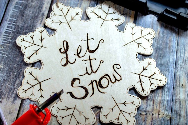 Wood Burned Snowflake Craft. Looking for some great winter decor? These easy to make wood burned snowflakes will look great hanging in your window, from a lamp or chandelier, or decorating your cupboards.